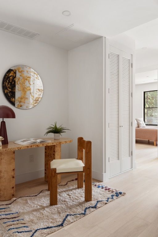 sitting room with hardwood / wood-style flooring