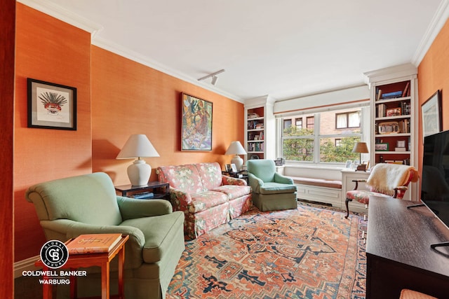 living room featuring built in features and ornamental molding