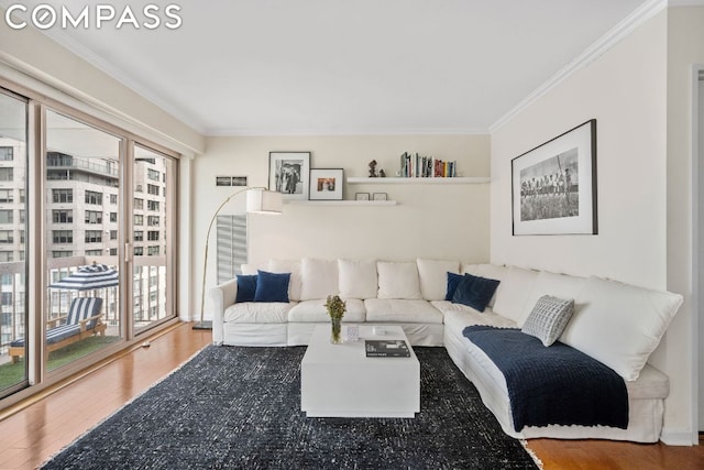 living room with ornamental molding and hardwood / wood-style floors