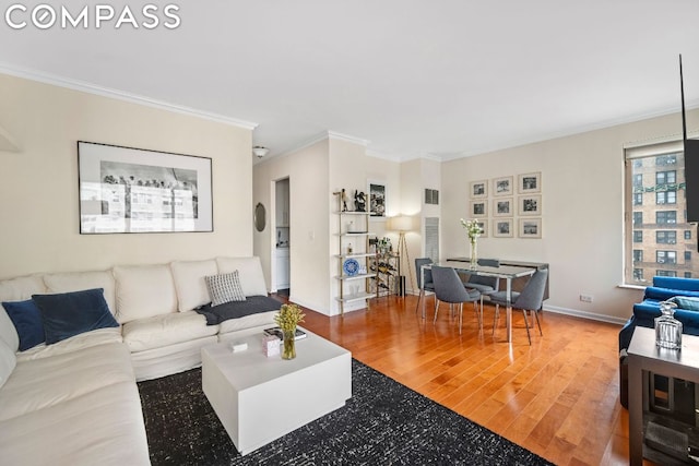 living room featuring ornamental molding and hardwood / wood-style floors