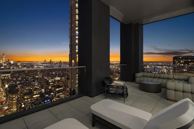 view of balcony at dusk