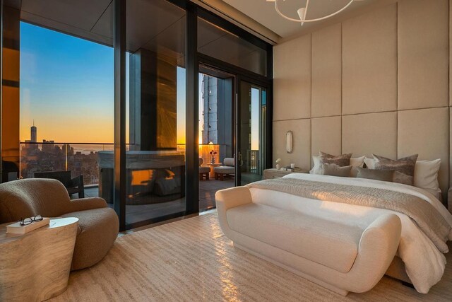 bedroom featuring expansive windows and multiple windows