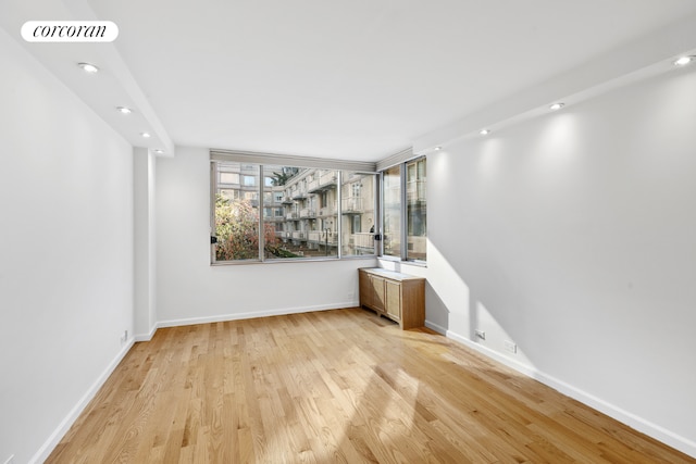 unfurnished room featuring baseboards, recessed lighting, visible vents, and light wood-style floors