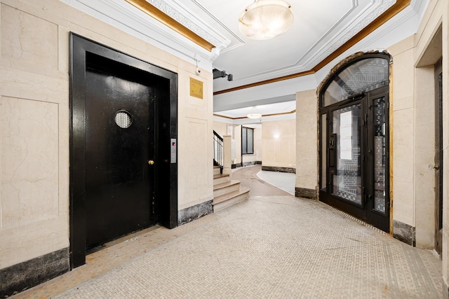 community lobby featuring crown molding and stairs