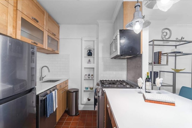 kitchen featuring sink, appliances with stainless steel finishes, tasteful backsplash, ornamental molding, and dark tile patterned flooring