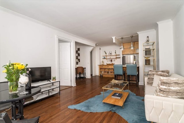 living room featuring dark hardwood / wood-style flooring and ornamental molding