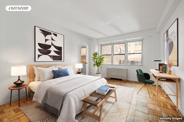 205 E 63rd St Unit 9B, New York City, NY 10065 - bedroom featuring radiator heating unit and baseboards