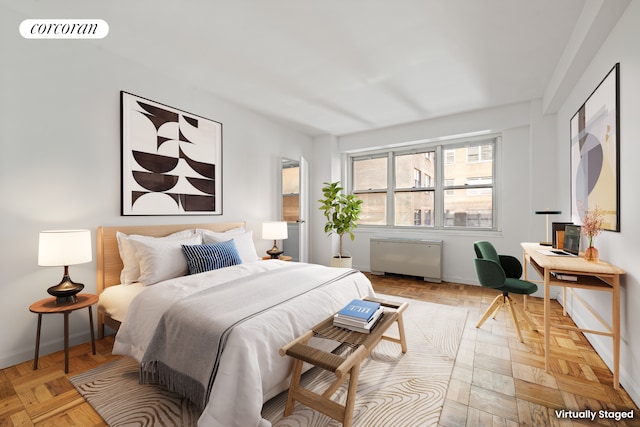 205 E 63rd St Unit 9B, New York City, NY 10065 - bedroom featuring radiator heating unit and baseboards