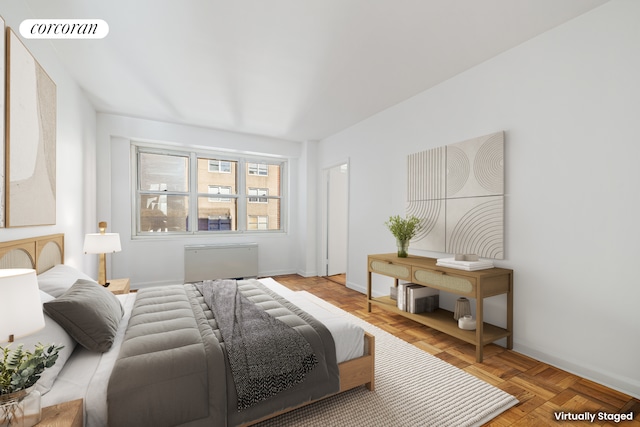 205 E 63rd St Unit 9B, New York City, NY 10065 - bedroom featuring radiator and baseboards