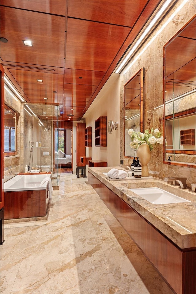 full bathroom with double vanity, a bathtub, a shower stall, wooden ceiling, and marble finish floor