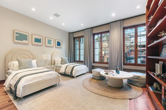 61 E 80th St, New York City, NY 10075 - bedroom with wood finished floors and recessed lighting