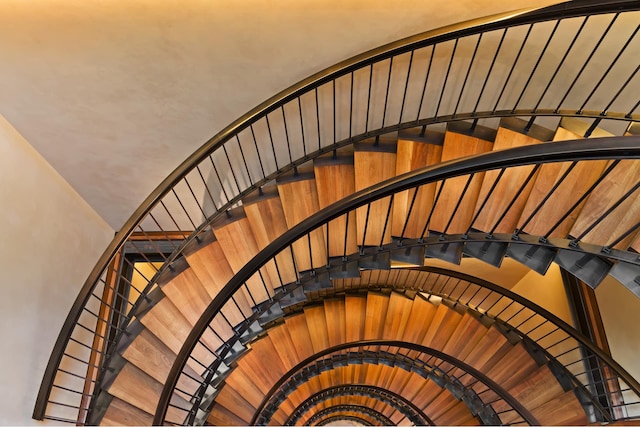 stairs with vaulted ceiling