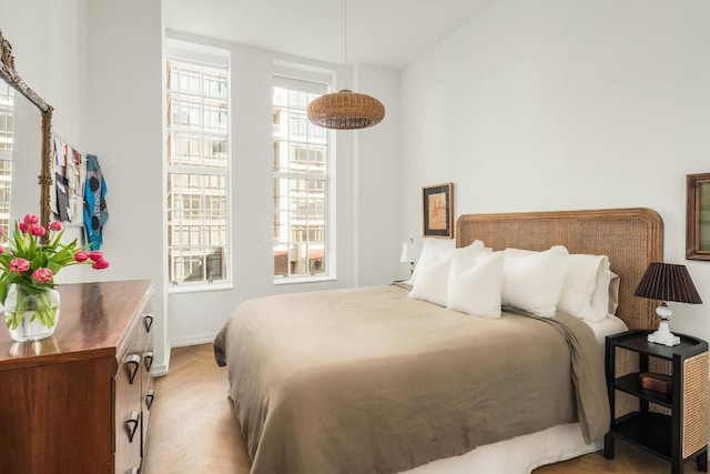 bedroom with light hardwood / wood-style floors