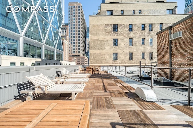 exterior space featuring a wall unit AC and a city view