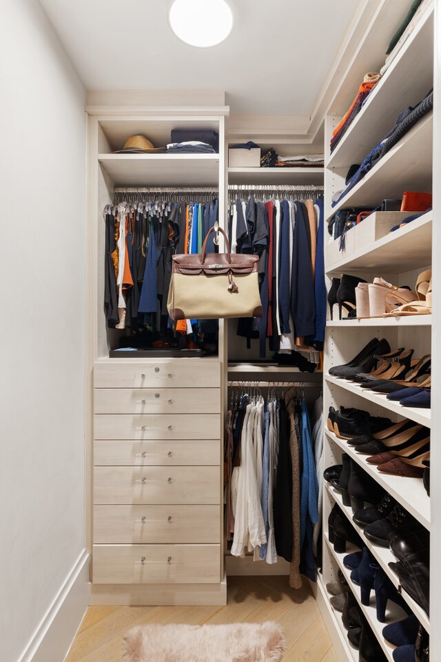 walk in closet featuring wood finished floors