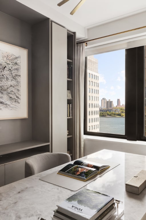 dining room featuring a water view