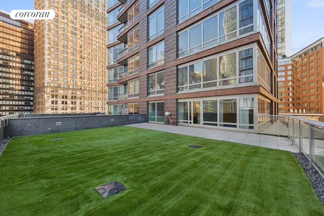 exterior space with fence and a yard