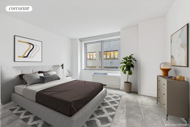 bedroom with visible vents, light carpet, and radiator heating unit