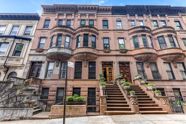 view of property featuring stairway