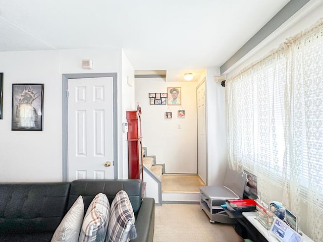 living room featuring stairs