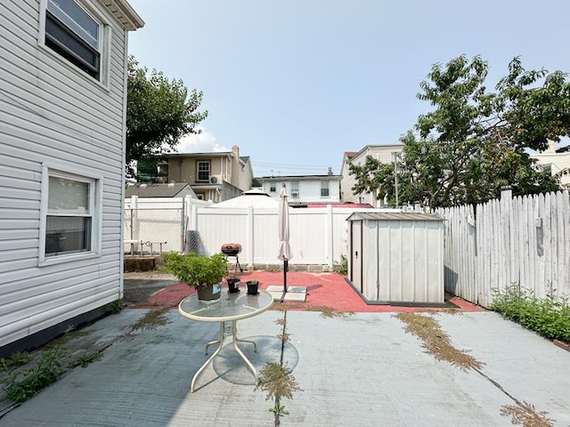 49 Steuben St, New York City, NY 10304 - view of patio with a storage shed, an outdoor structure, and a fenced backyard