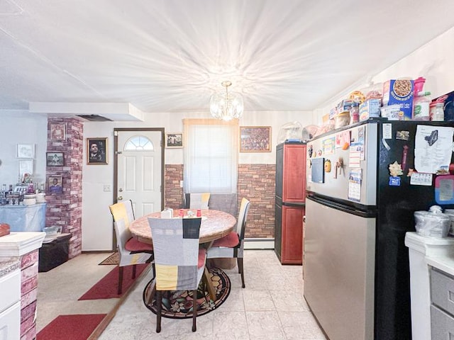 dining room featuring a baseboard radiator and a notable chandelier