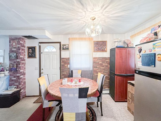 49 Steuben St, New York City, NY 10304 - dining space featuring a chandelier and a baseboard heating unit