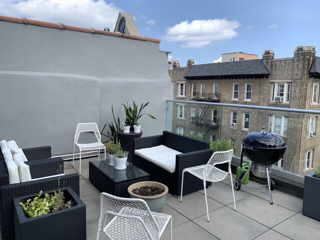 exterior space featuring area for grilling and an outdoor hangout area