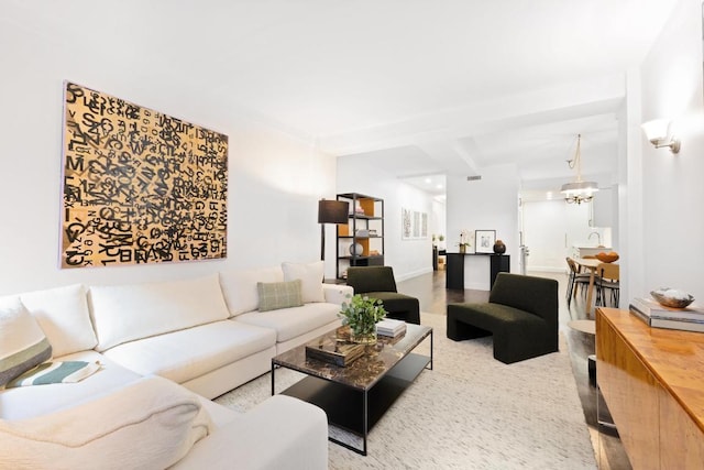 living room featuring an inviting chandelier