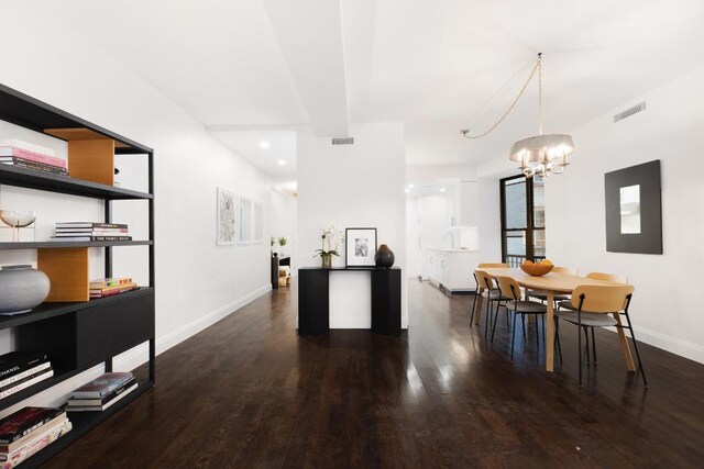 kitchen with white cabinets, sink, light stone counters, and stainless steel appliances