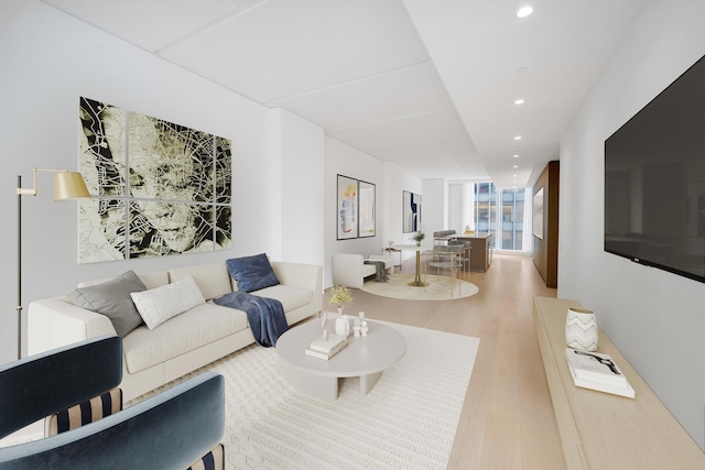 living area with recessed lighting and wood finished floors