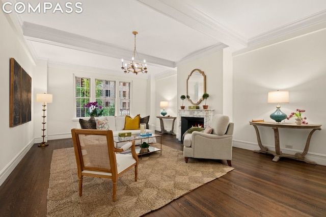 living room featuring dark wood-type flooring, beamed ceiling, ornamental molding, and a notable chandelier