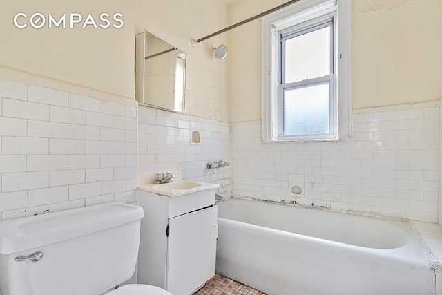 88 Brooklyn Ave Unit D5, New York City, NY 11216 - bathroom with tile walls, a tub to relax in, vanity, and wainscoting