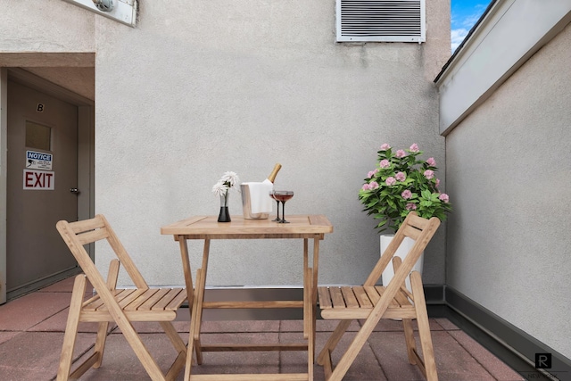 exterior space with a balcony and visible vents