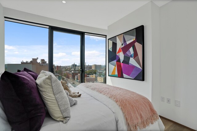 179 20th St Unit 8B, New York City, NY 11232 - bedroom with a city view and wood finished floors