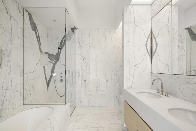 bathroom with vanity, separate shower and tub, and tile walls