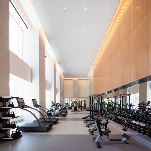 gym featuring a high ceiling and healthy amount of natural light