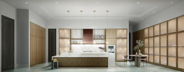 kitchen with modern cabinets, decorative light fixtures, light countertops, a large island, and white oven