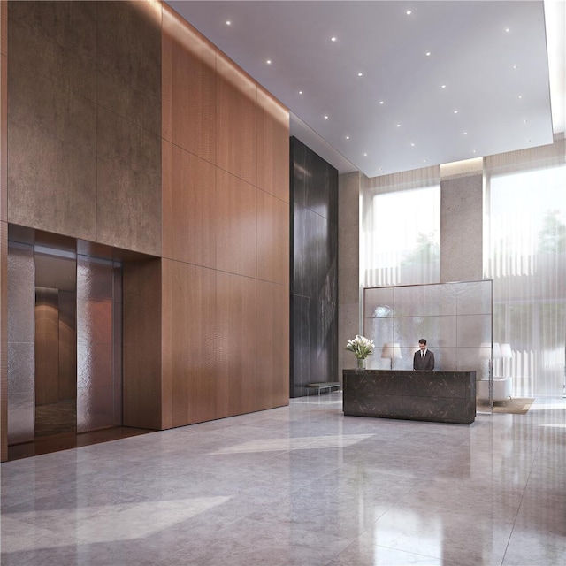 community lobby featuring a towering ceiling