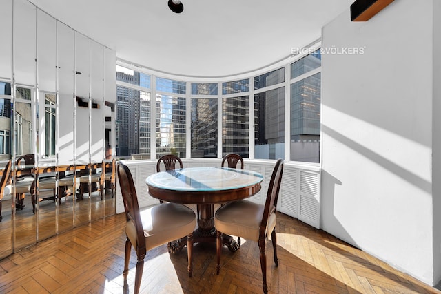 dining space featuring floor to ceiling windows