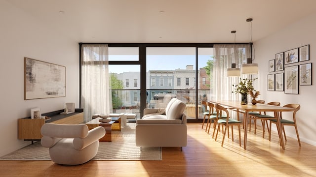 interior space featuring a wall of windows and light hardwood / wood-style floors