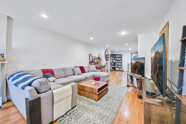 living area featuring wood finished floors and recessed lighting