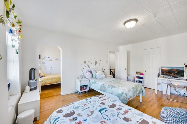 bedroom featuring wood-type flooring