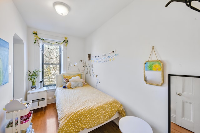 bedroom featuring wood finished floors