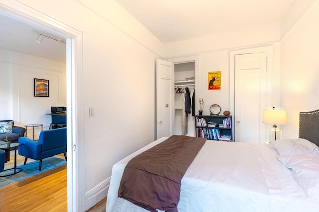 bedroom featuring light hardwood / wood-style floors and a closet