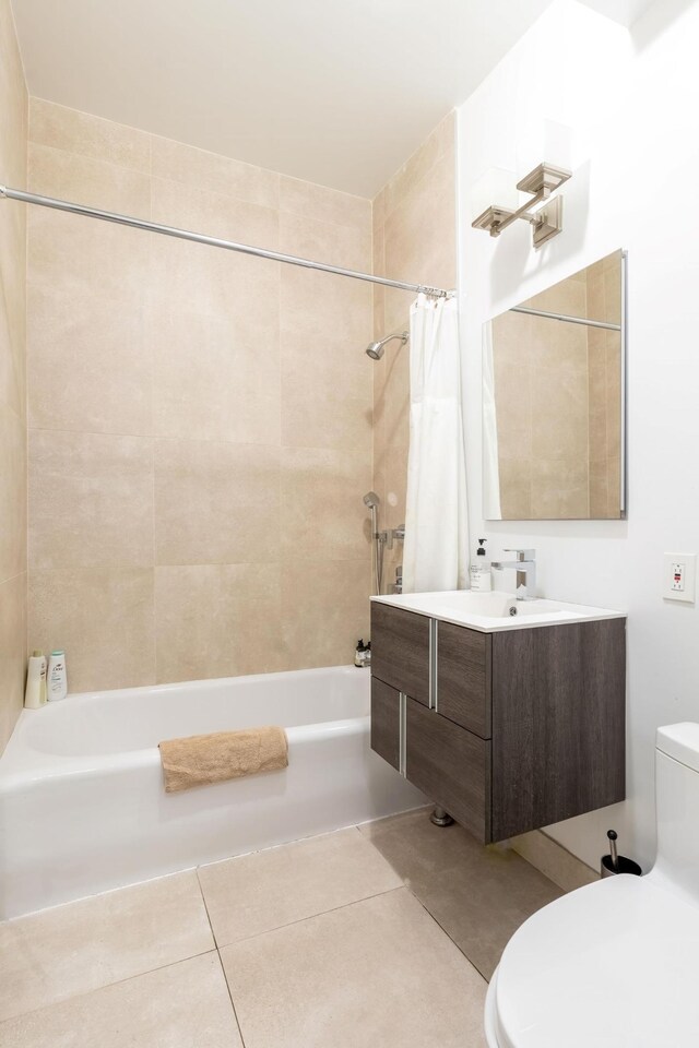 bedroom with radiator heating unit, multiple windows, and light hardwood / wood-style floors