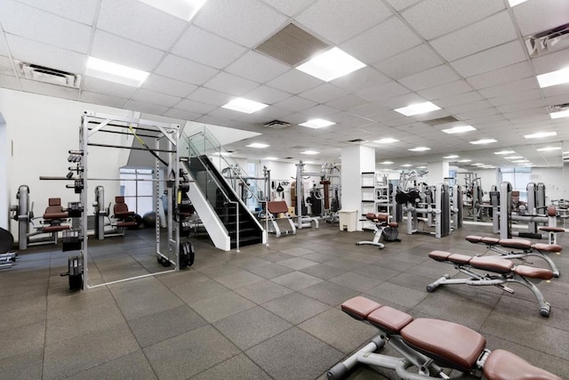 workout area with a paneled ceiling