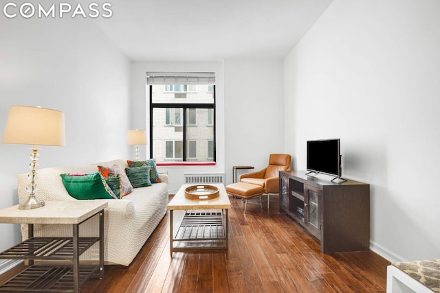 living room with dark hardwood / wood-style floors