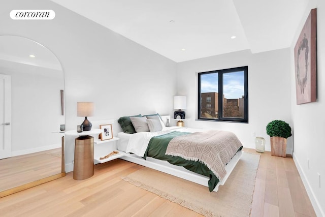 bedroom with wood-type flooring