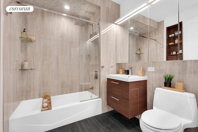 30-57 Crescent St Unit 3B, New York City, NY 11102 - bathroom with tile walls, washtub / shower combination, and vanity